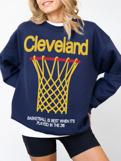 Cleveland Cavaliers heavyweight retro basketball streetwear crewneck in navy with oversized yellow graphic for men and women for sale at Throwbacks