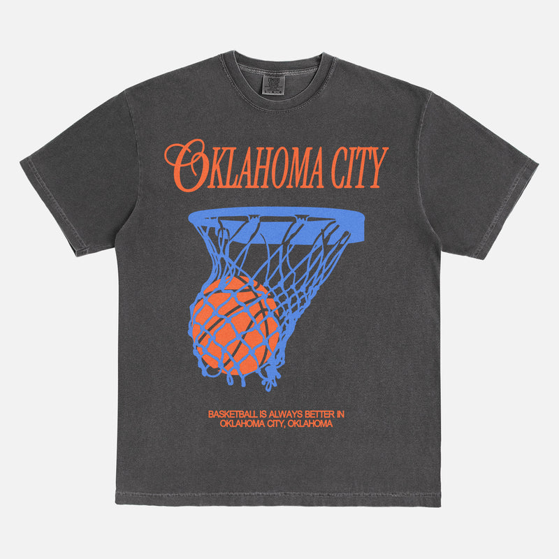 Vintage washed black Oklahoma City basketball t-shirt with royal blue and orange OKC thunder bball graphic on a unisex Comfort Colors tee