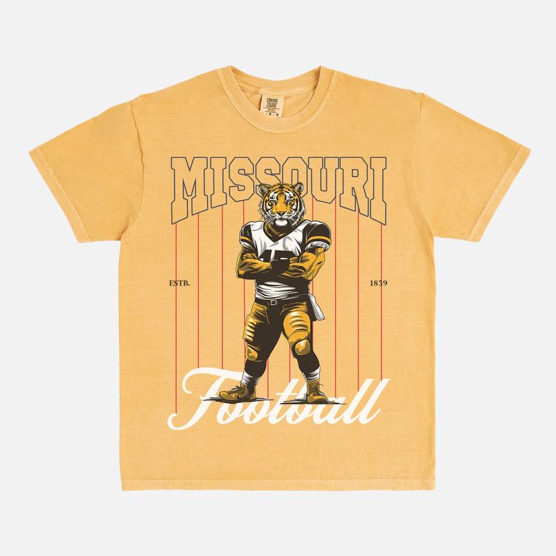 Missouri Tigers football graphic tee with a vintage tiger mascot design on a washed yellow comfort colors t-shirt