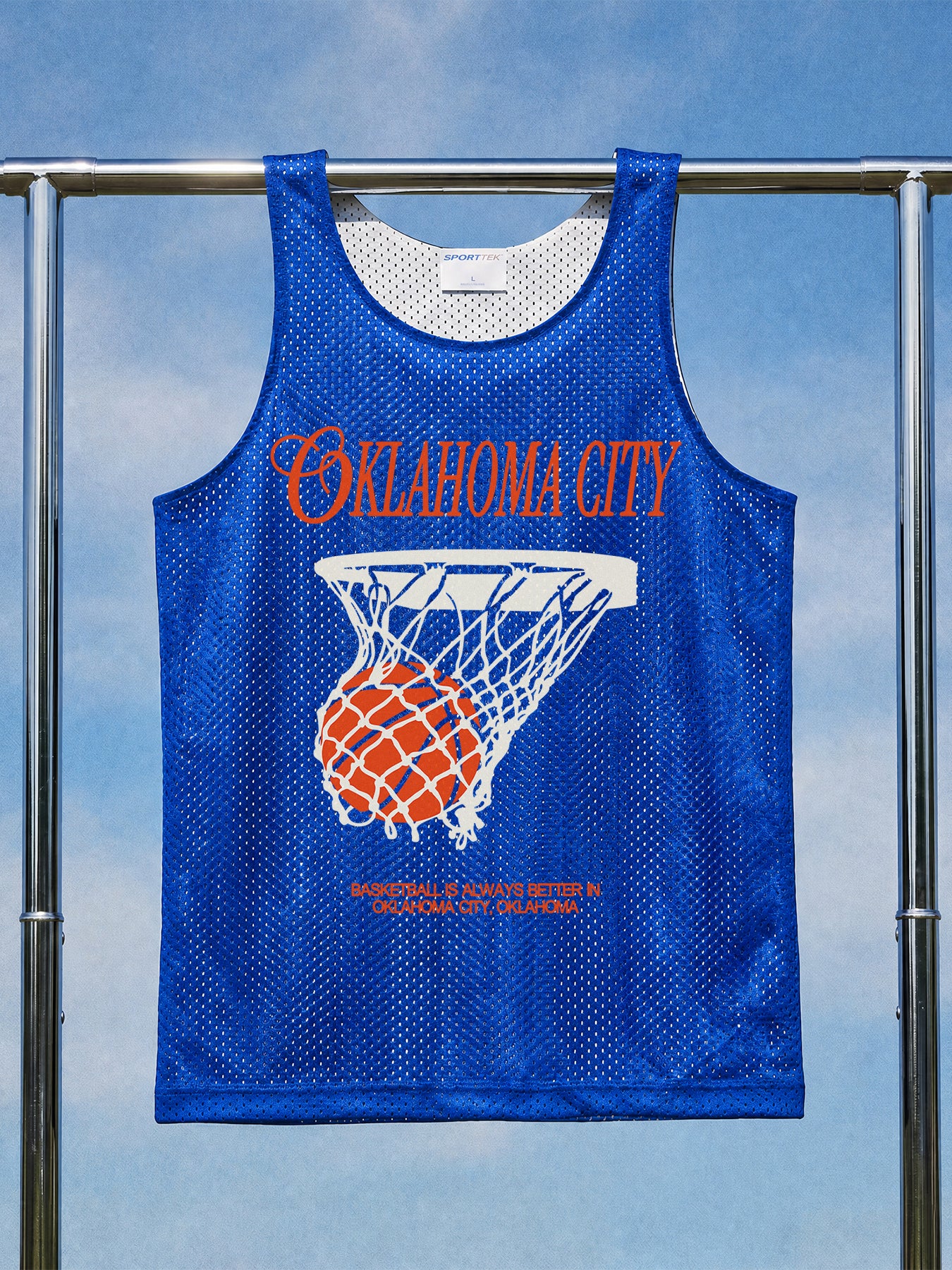 OKC Thunder basketball mesh training jersey with blue and orange streetwear graphic on a reversible unisex blue jersey
