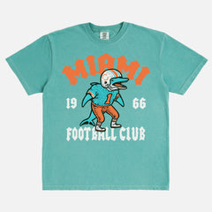 Cool retro Miami Dolphins NFL streetwear graphic t-shirt on washed teal green comfort colors shirt 