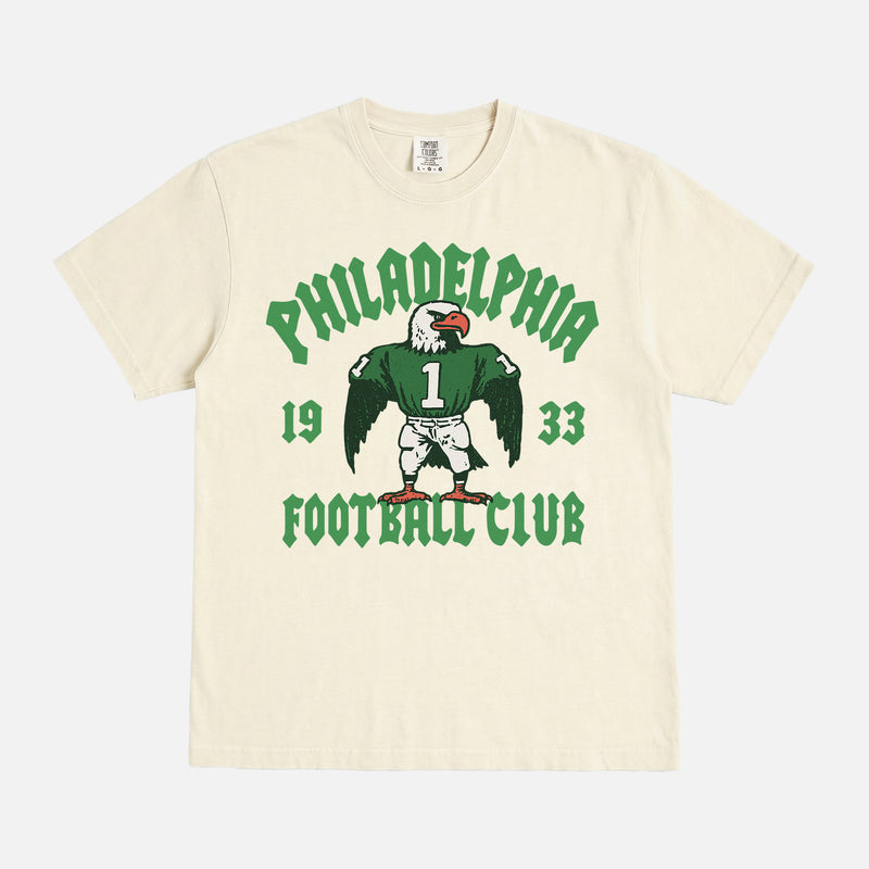 Philadelphia eagles nfl streetwear graphic tee with throwback eagle mascot on a faded cream t-shirt