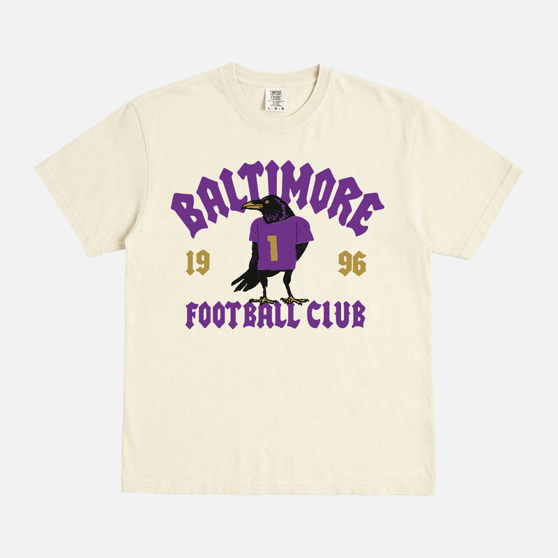 Retro black and purple Baltimore ravens nfl football fan graphic tee with streetwear text and raven mascot