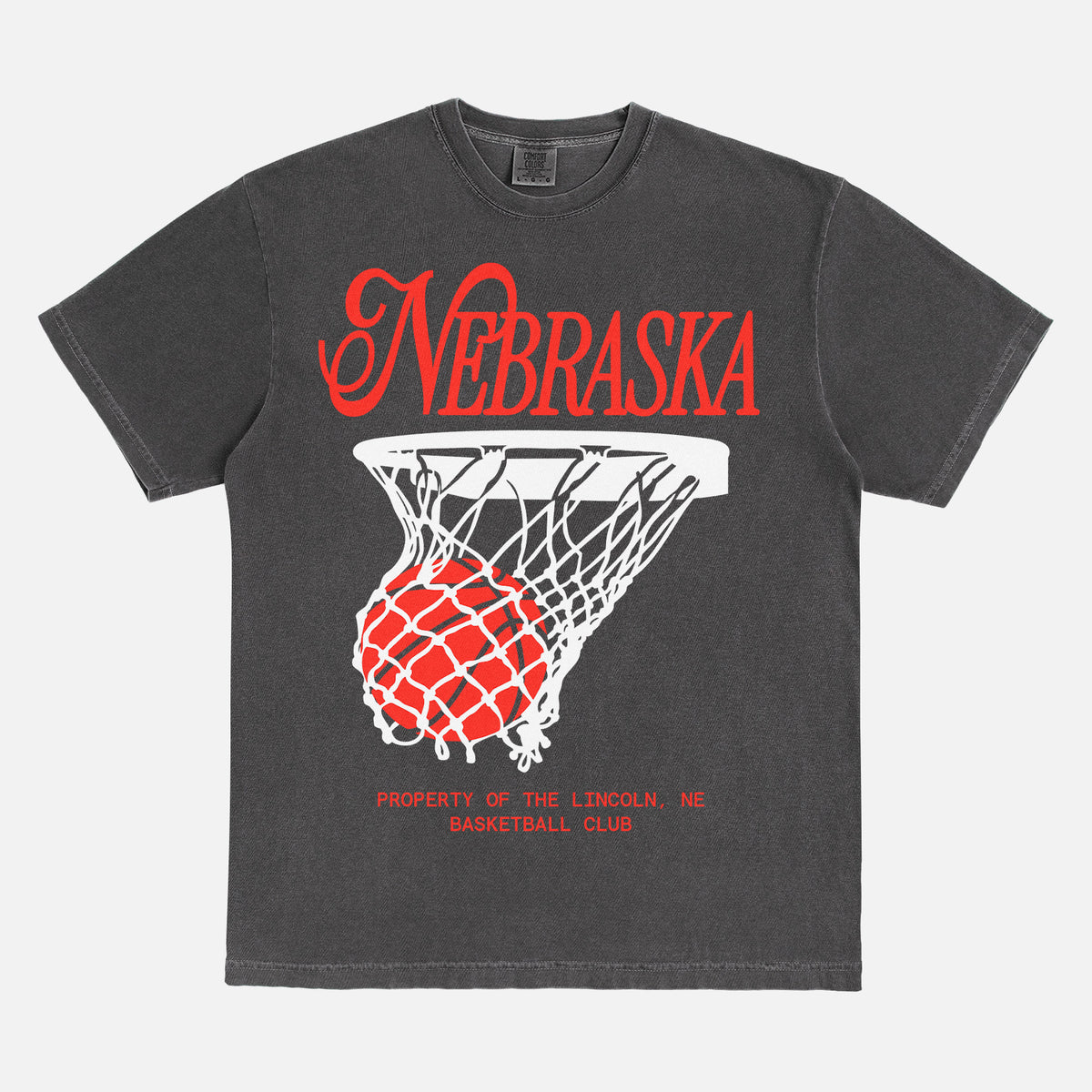 Retro Nebraska Cornhuskers t-shirt with retro college basketball streetwear graphic on a washed black comfort colors tee