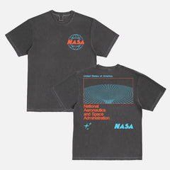 NASA logo graphic tee shirt with front and back print and oversized wormhole graphic and retro logo on a washed black unisex heayweight Comfort Colors t-shirt