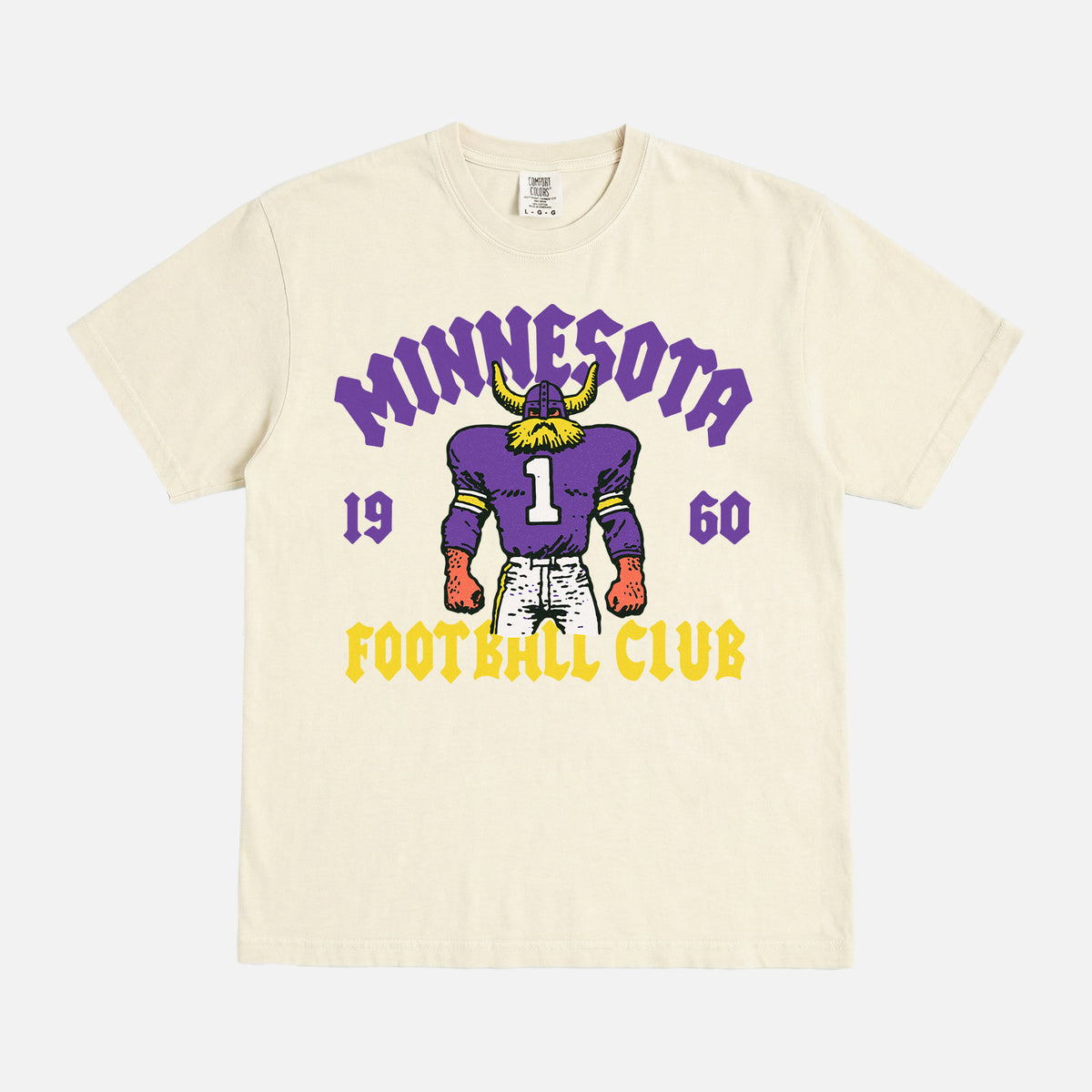 Minnesota Vikings NFL football fan streetwear graphic t-shirt with throwback viking mascot on a faded cream comfort colors shirt