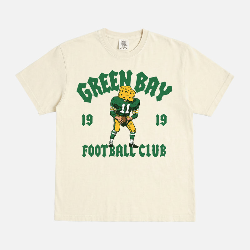 Modern vintage Green Bay Packers t-shirt with vintage mascot streetwear style graphic on a washed cream comfort  colors shirt