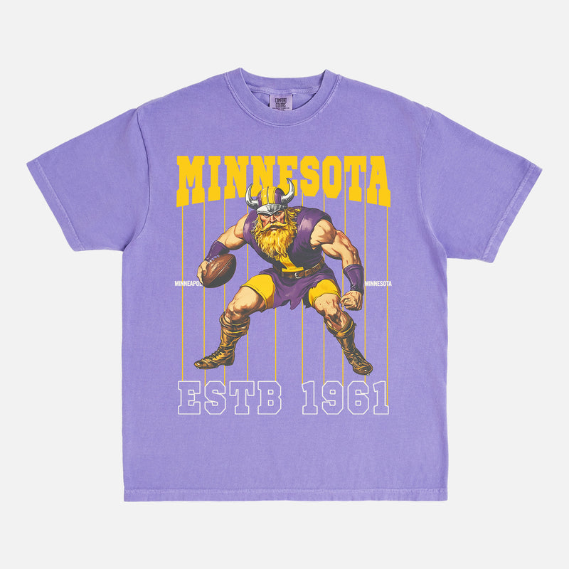 old school minnesota vikings graphic t-shirt with retro mascot pinstripes design on a washed purple comfort colors tee