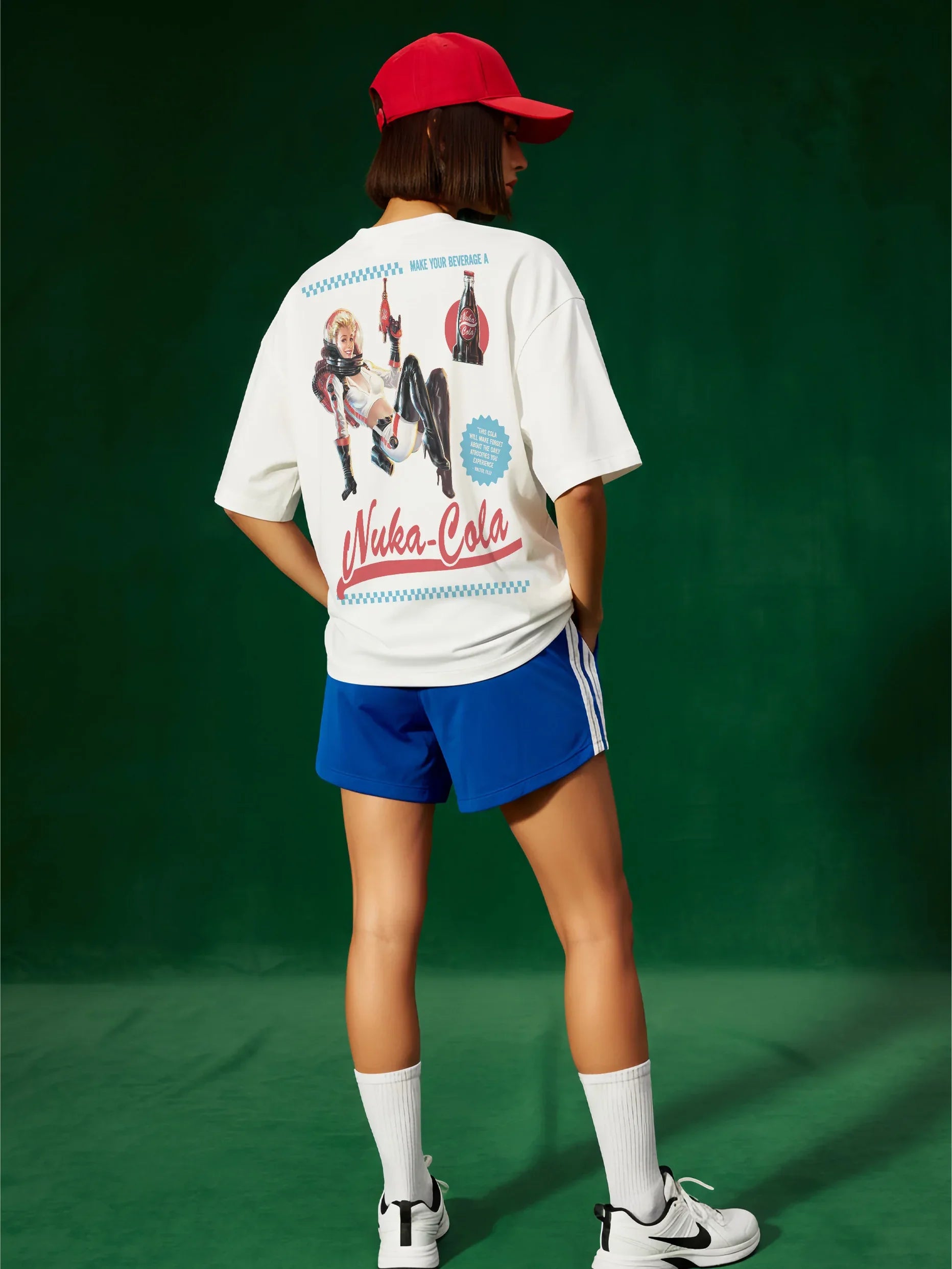White red and blue fallout video game tv show graphic tee shirt with Nuka Cola bottle cap logo and retro space girl ad for men and women for sale at Throwbacks